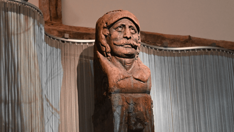 Image showing wooden carved head of a man that once took a prominent position on 17th century merchant ship, also known as the Swash Channel wreck.